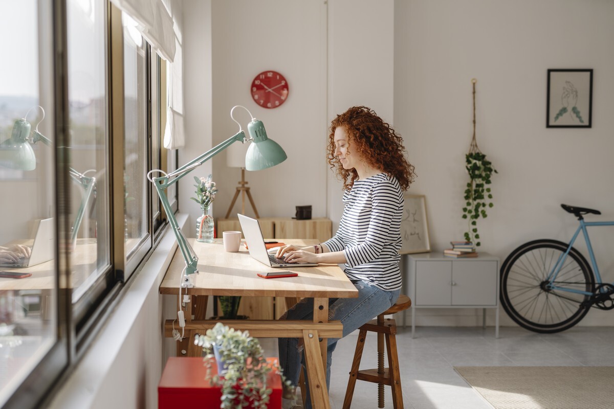 woman with curly hair on laptop