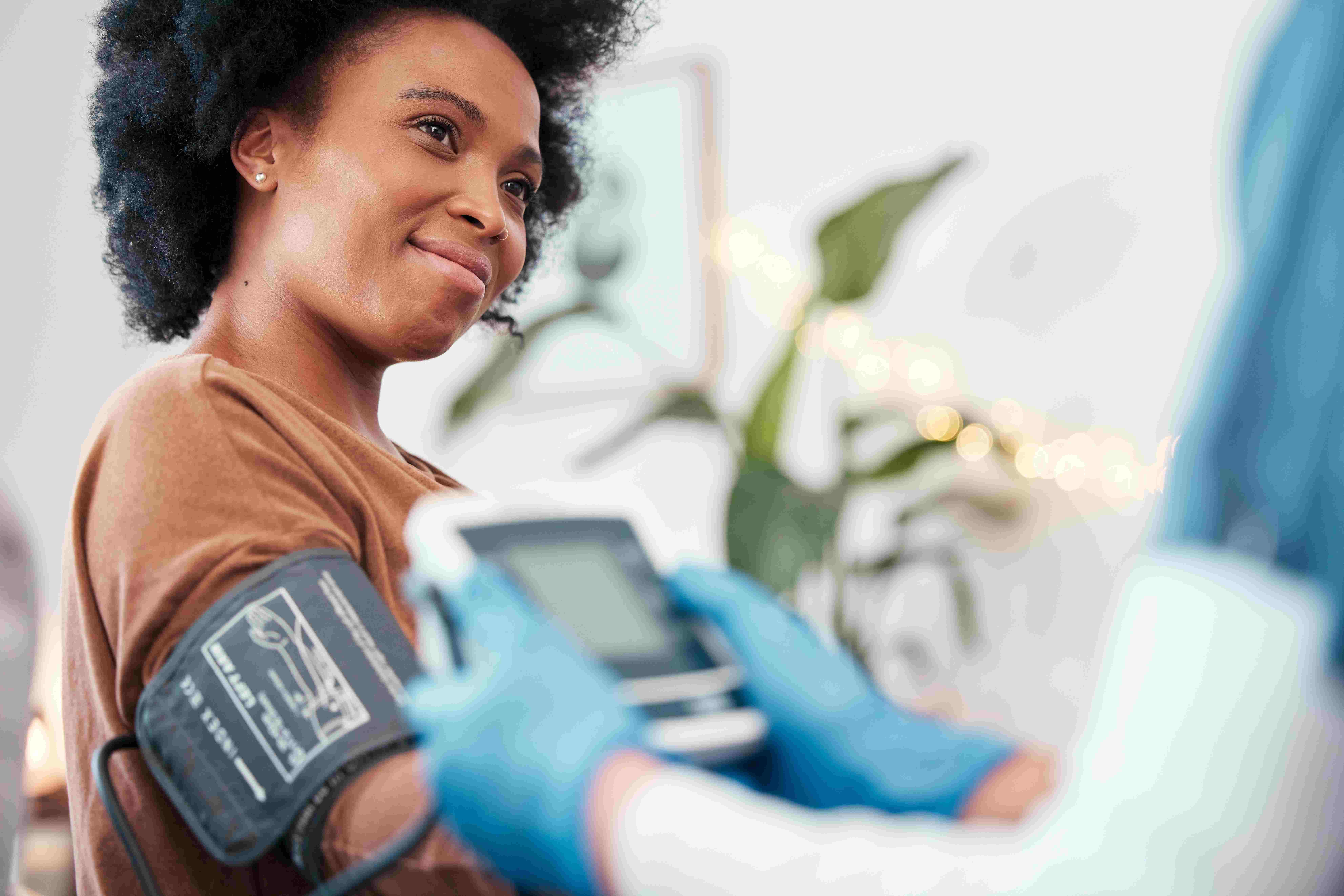 Black woman, healthcare and blood pressure machine in checkup
