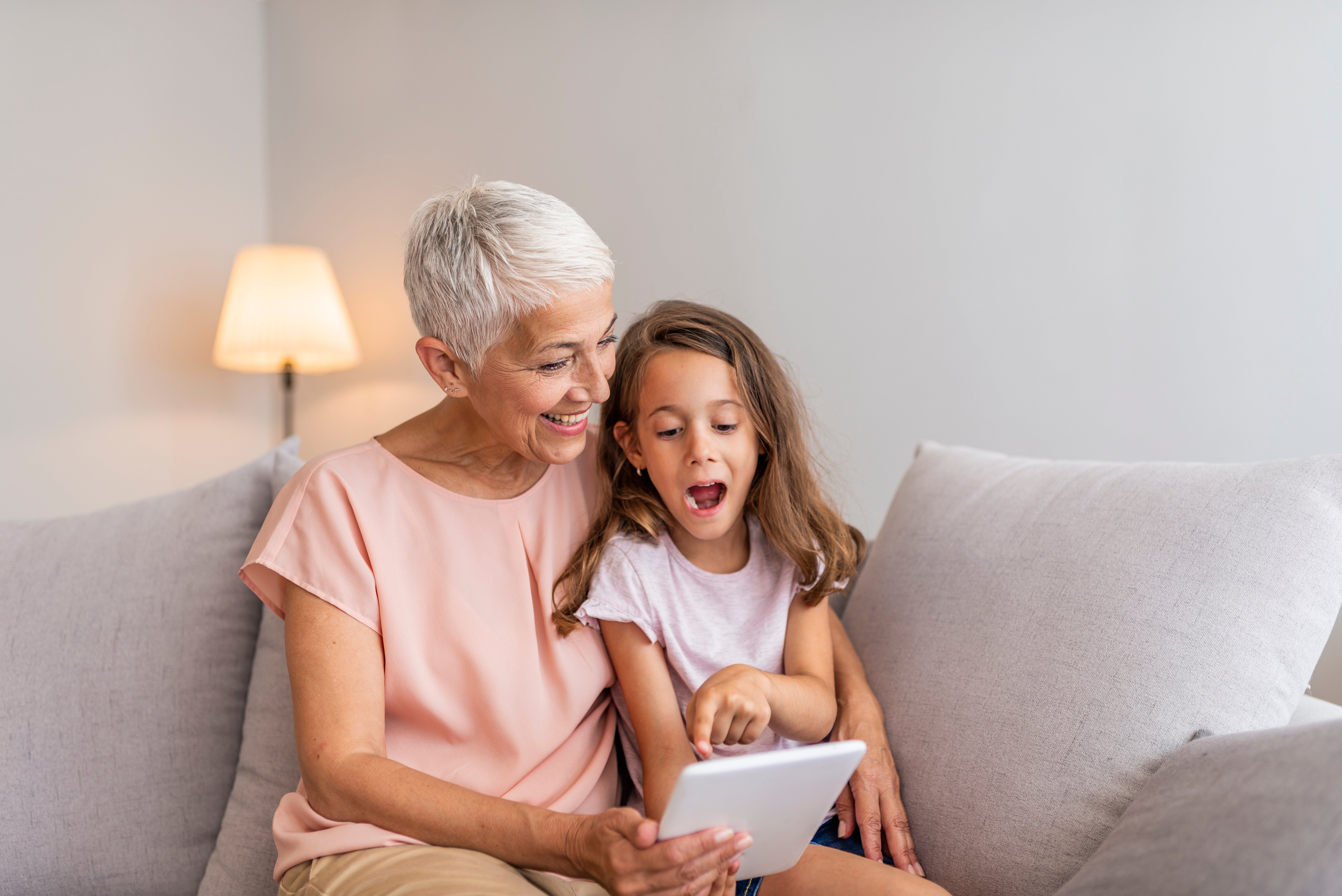 Gran mother and child on tablet