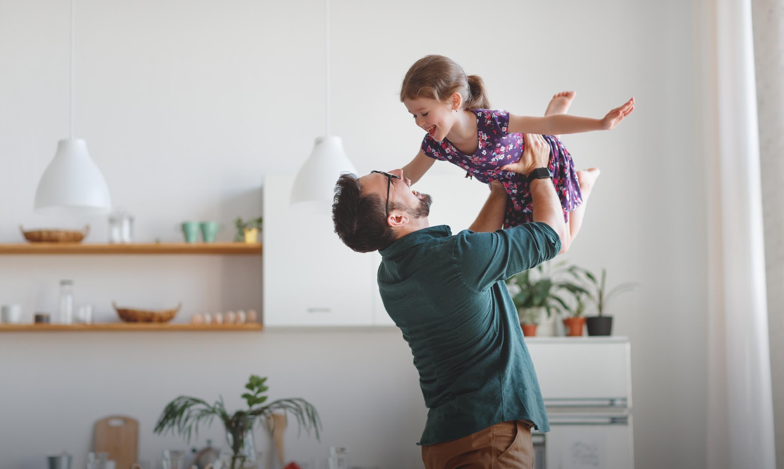 Father and daughter playing together