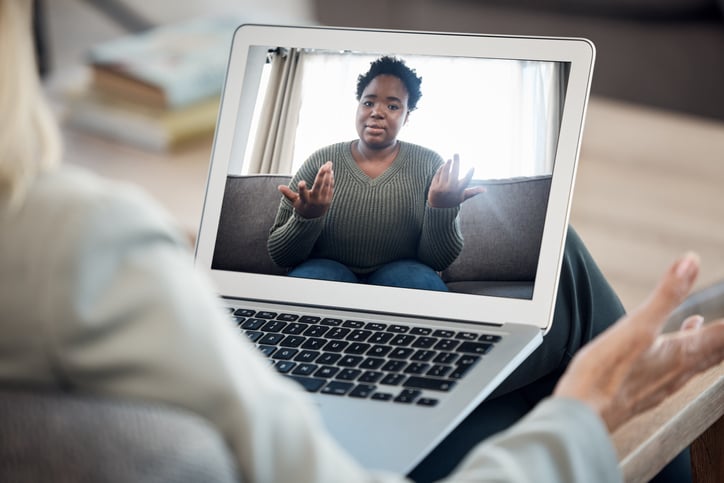 Woman, video call and therapy on laptop screen for support,