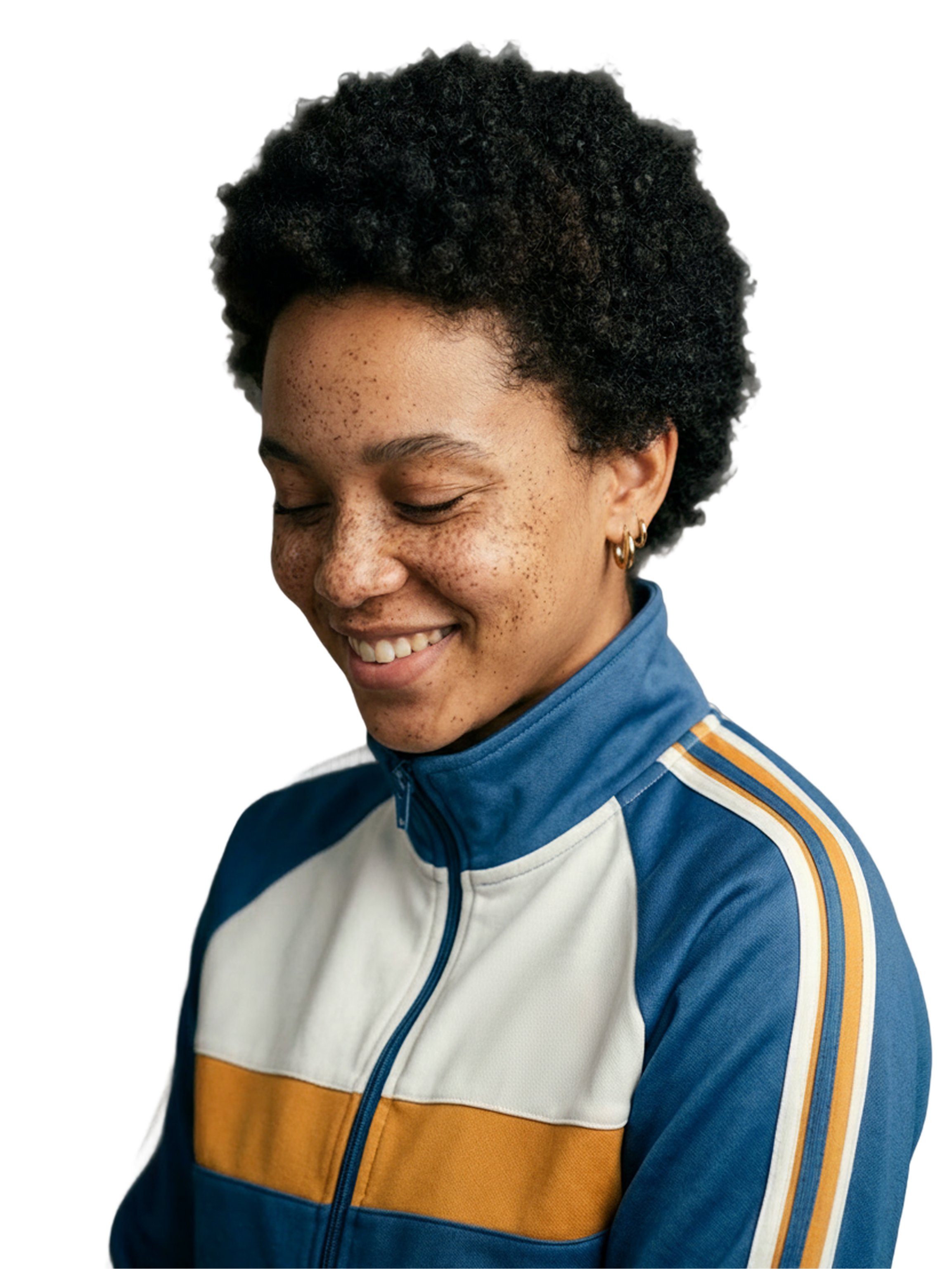 Women looking down in a blue and mustard jacket standing behind a cream background