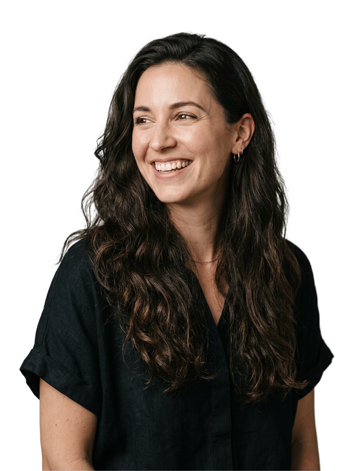 Smiling woman with long dark hair in a dark top, against a plain green studio backdrop