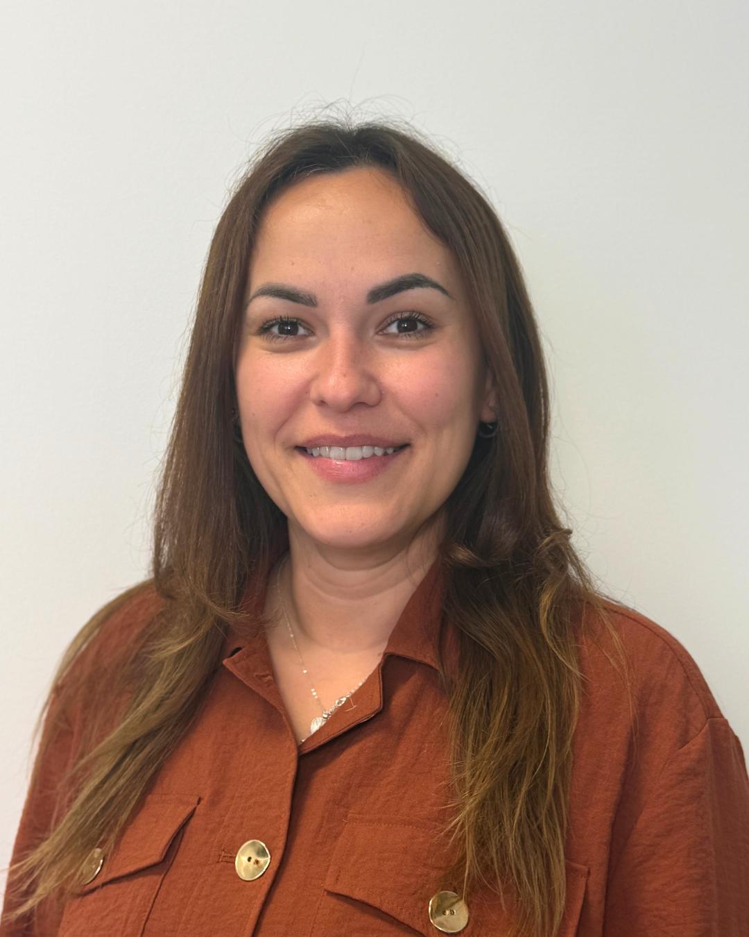 Headshot of Roxana Lines, Clinical Director (Advanced Clinical Practitioners), smiling with long brown hair