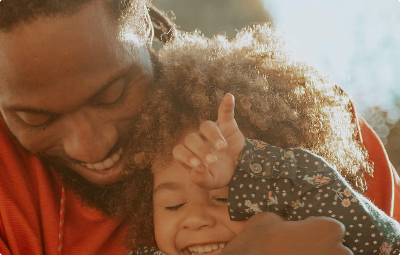 man smiling with son