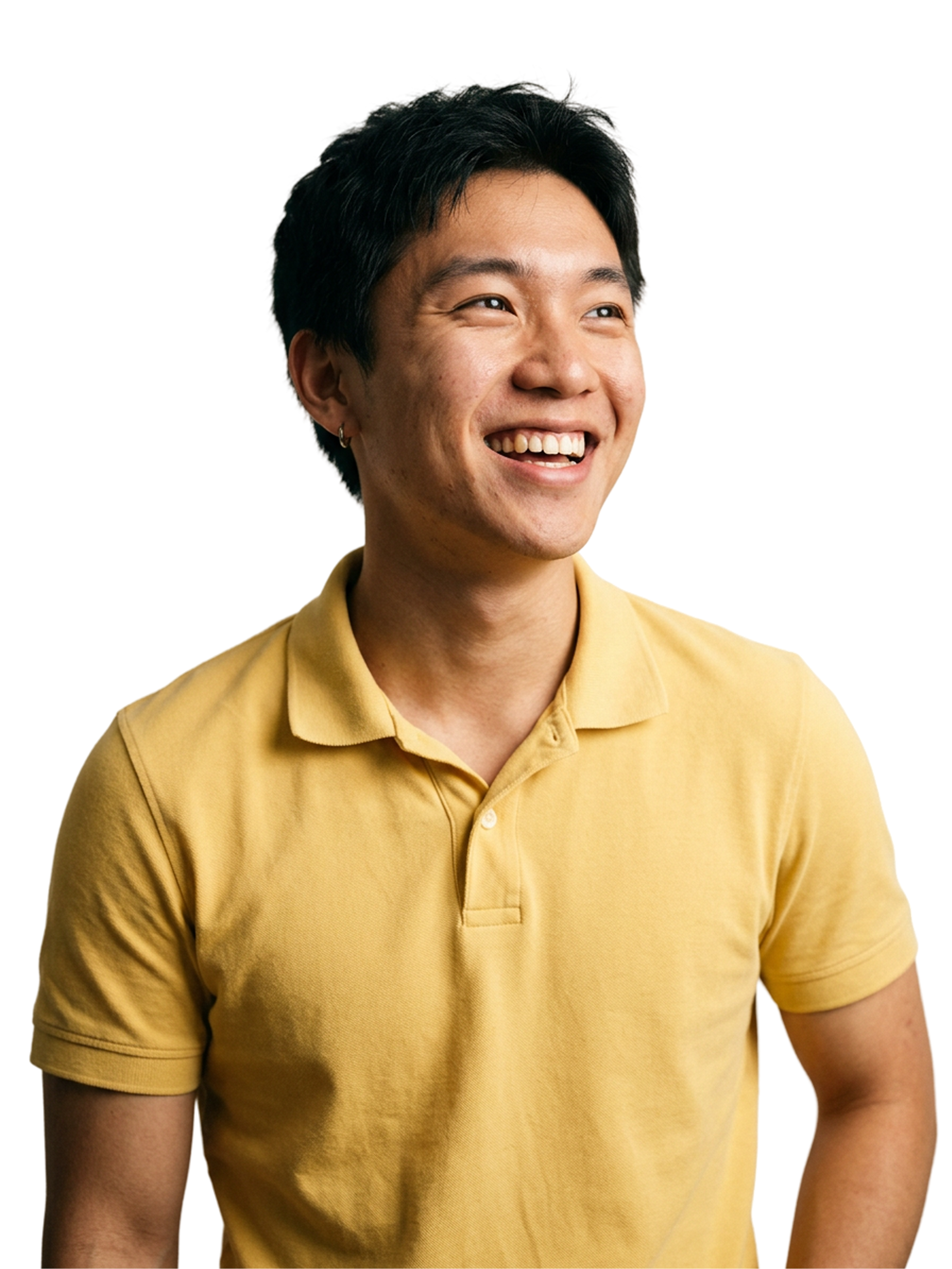 Smiling man in a yellow polo shirt against a soft green background