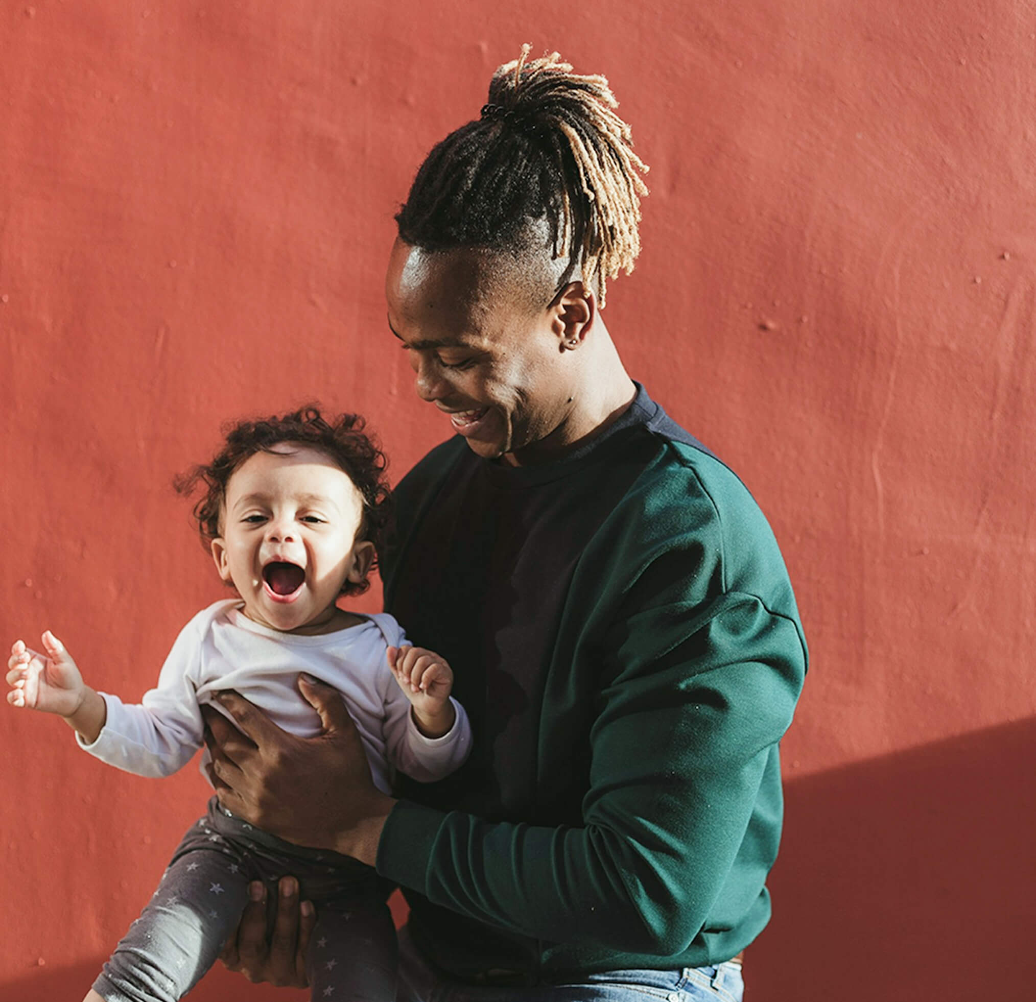Father and son smiling together