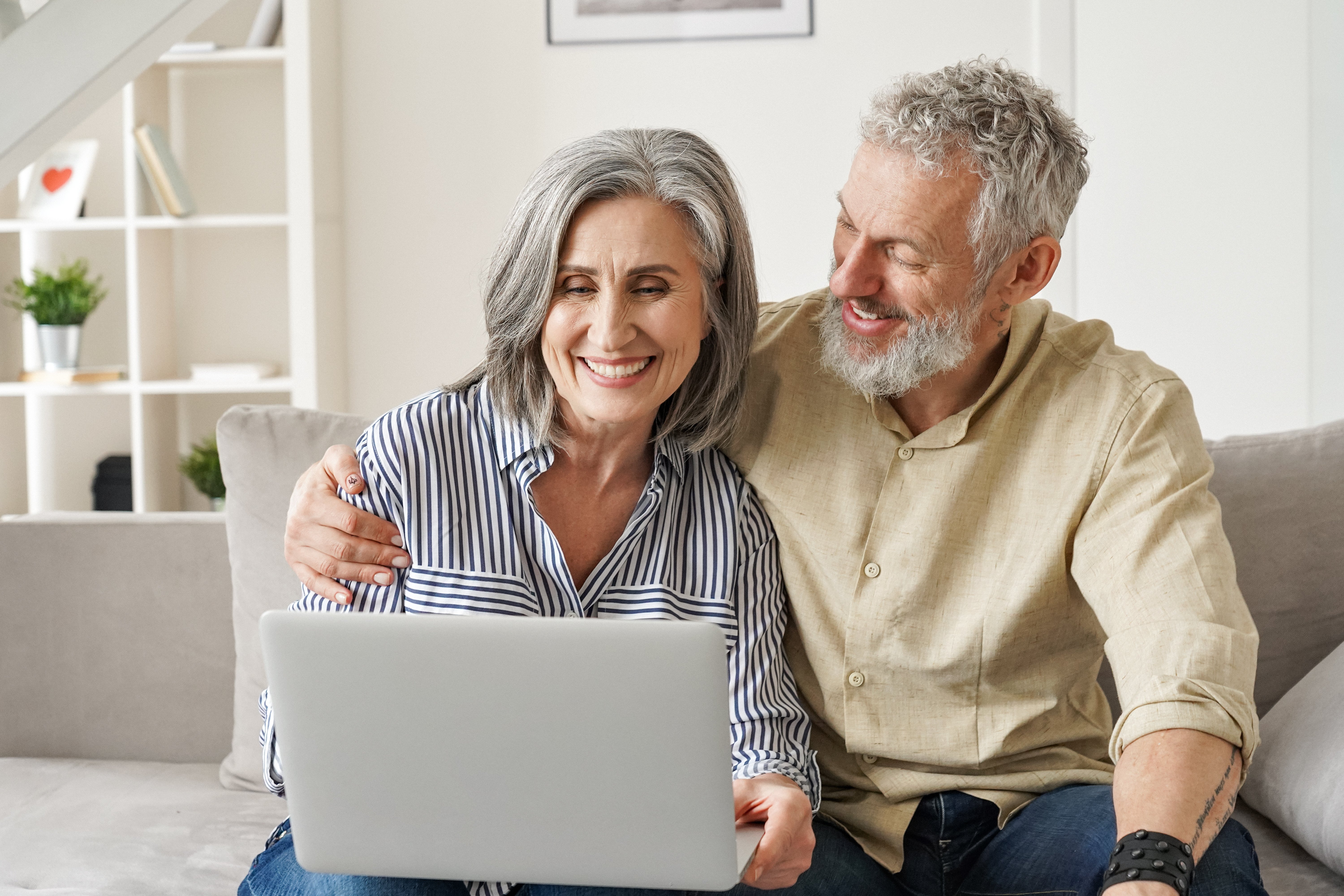 Elderly couple on laptop