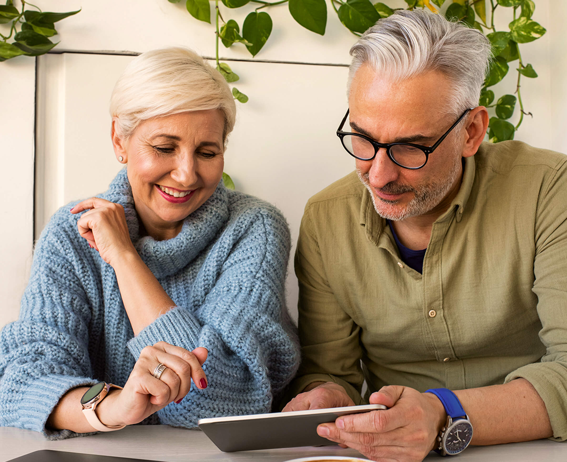 Senior couple using tablet together