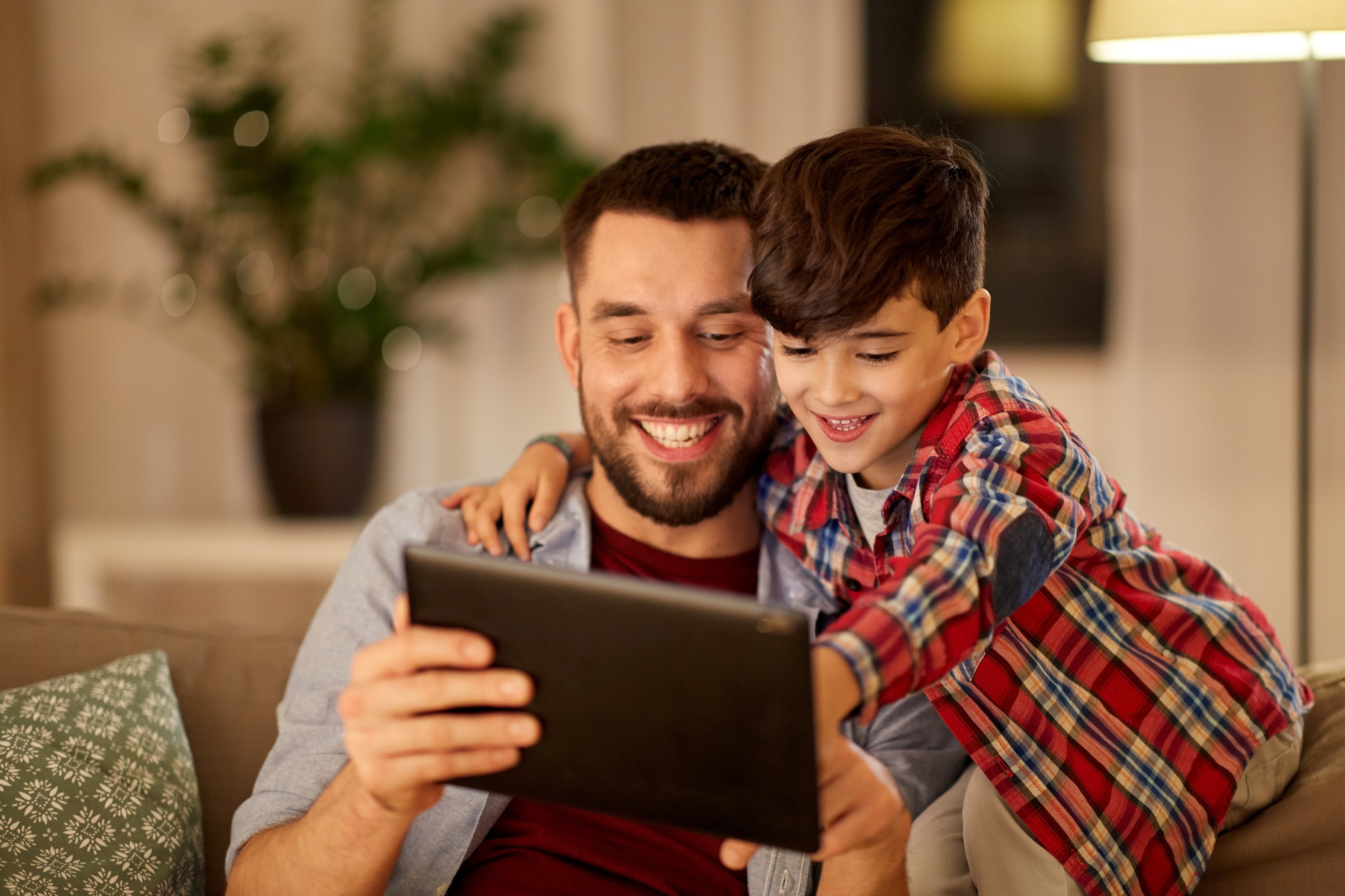 Father and son on tablet