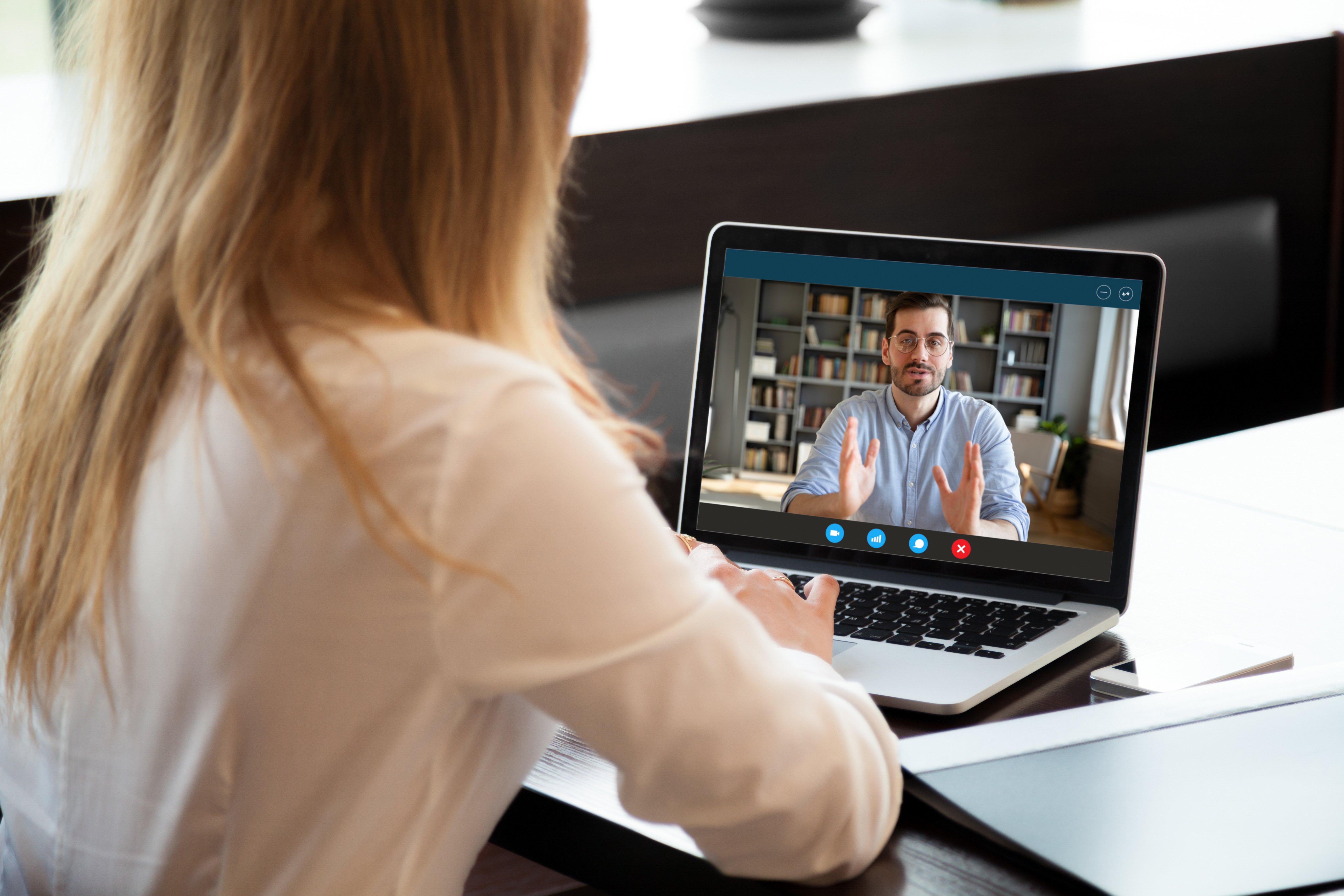 Man on laptop on call