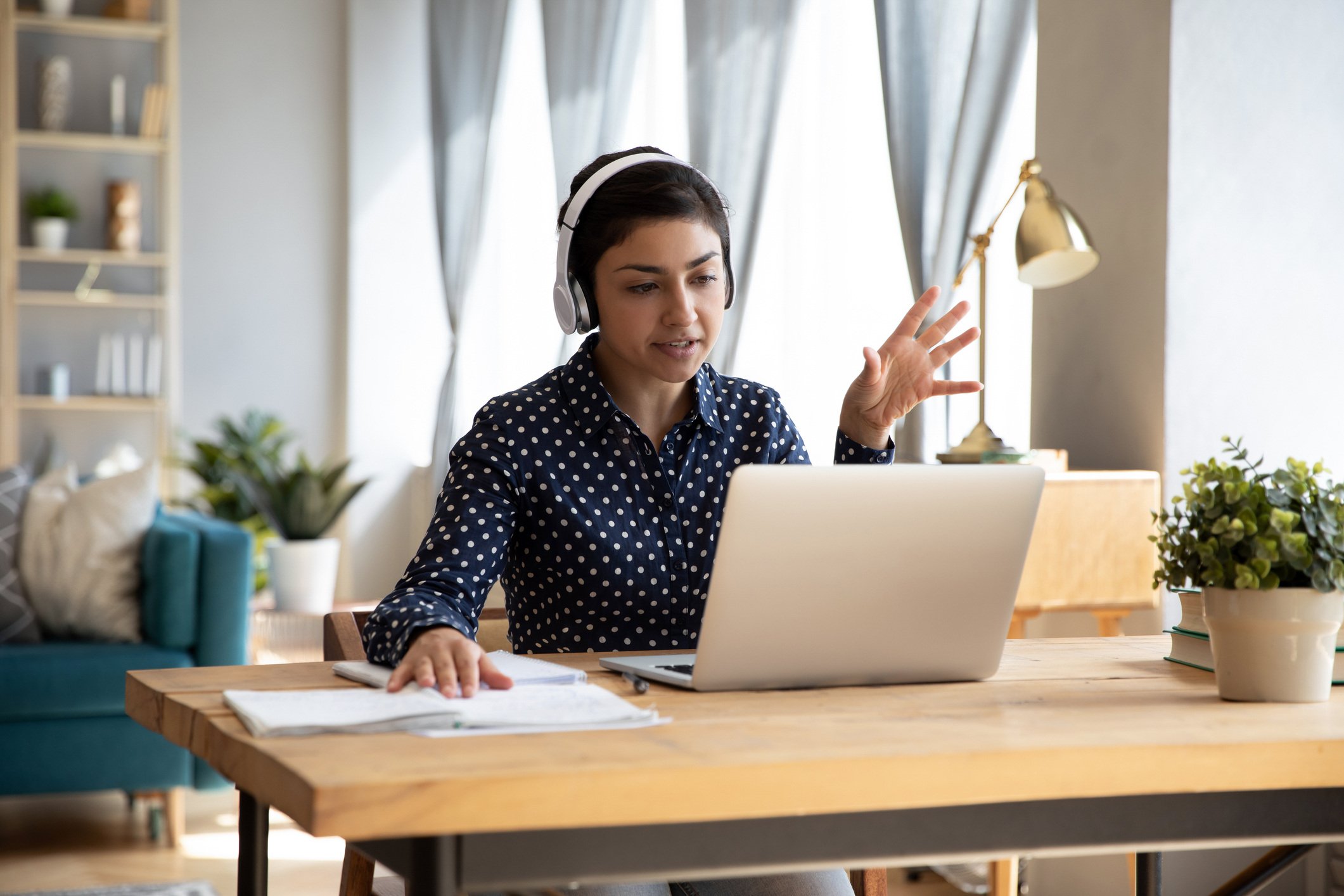 Asion lady on video call on laptop