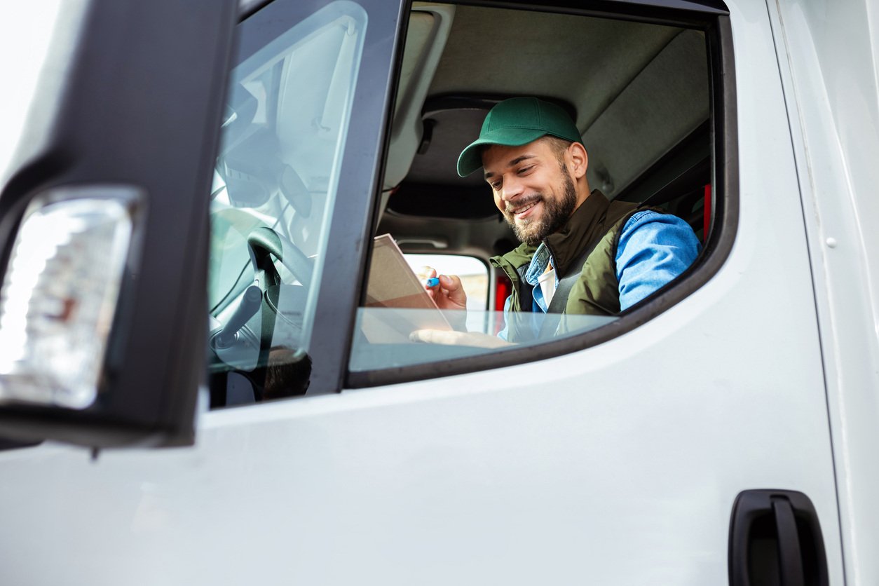 Man in a truck looking at an iPad