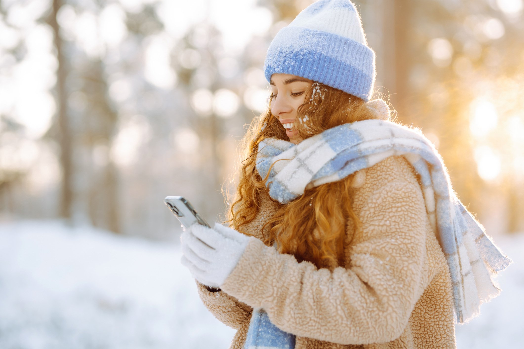 Person on phone in snowy landscape