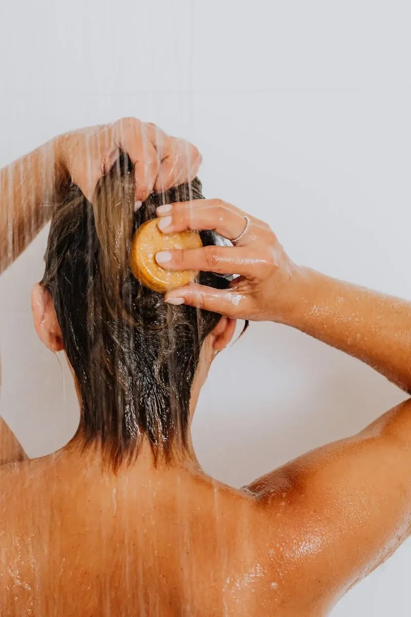 woman-washing-hair-shampoo-bar